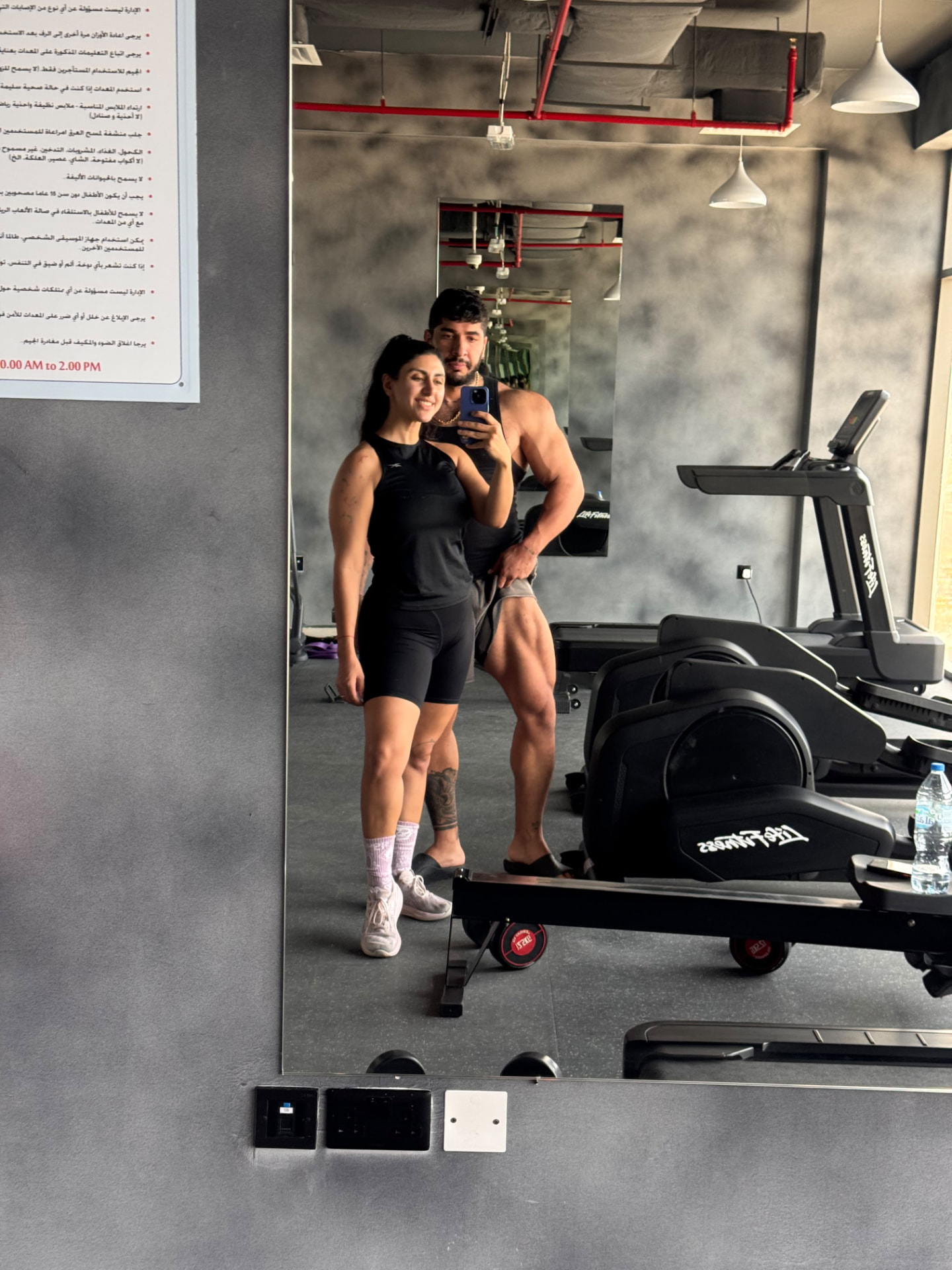Sadaf and Arash mirror selfie in a Dubai gym