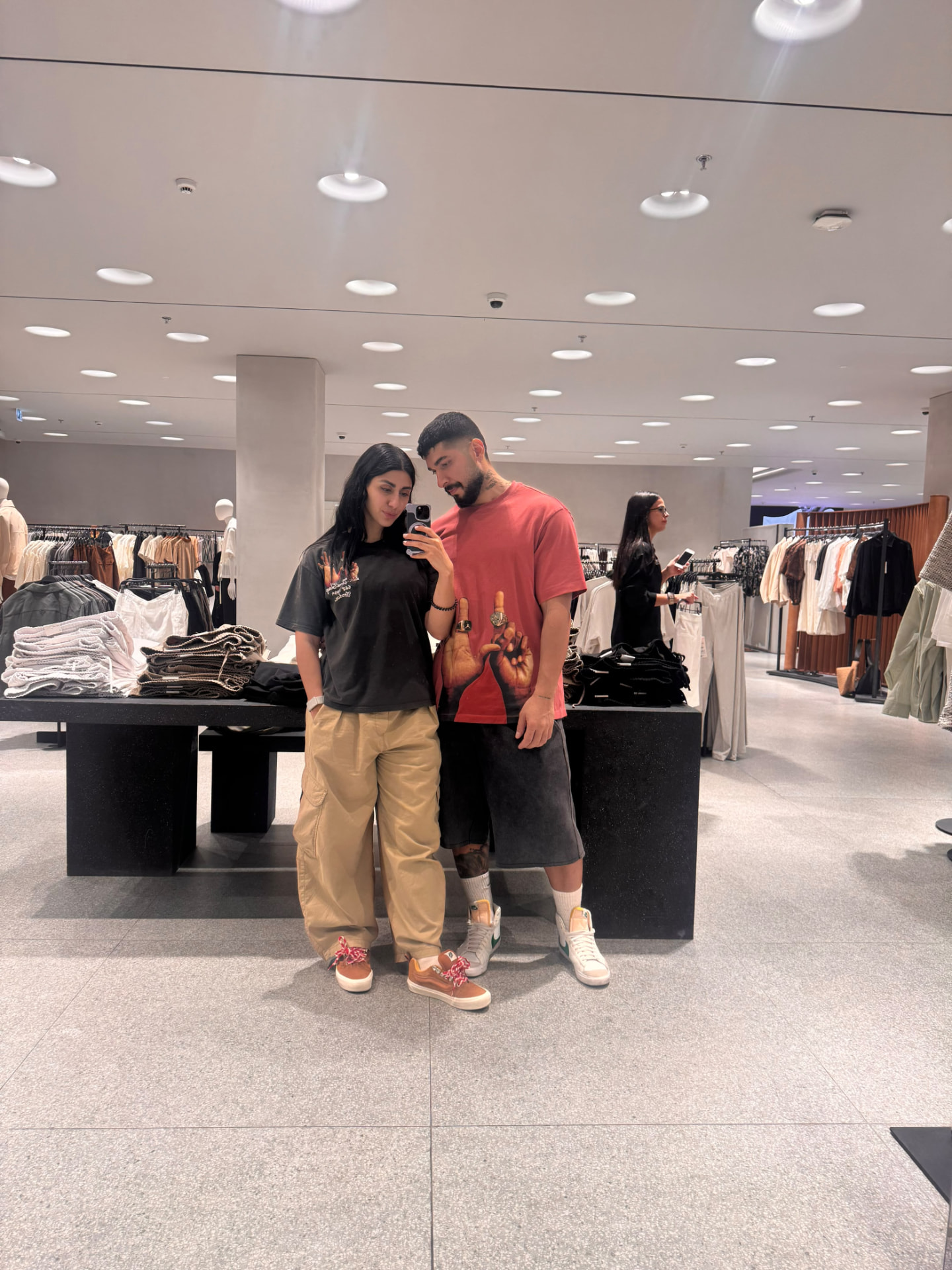 Sadaf and Arash mirror selfie while shopping